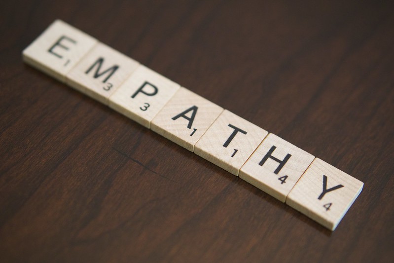 Photo of wooden tiles spelling the word empathy.