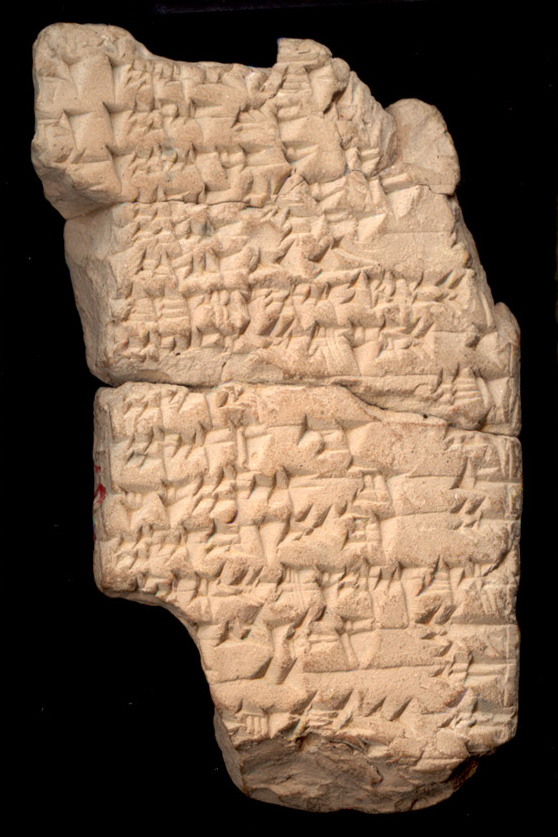 stone tablet with carved cuneiform writing