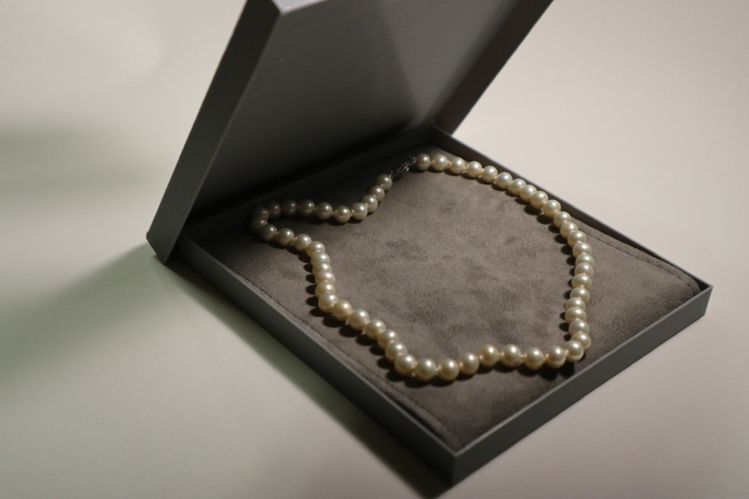 Pearl necklace sitting inside of an open giftbox