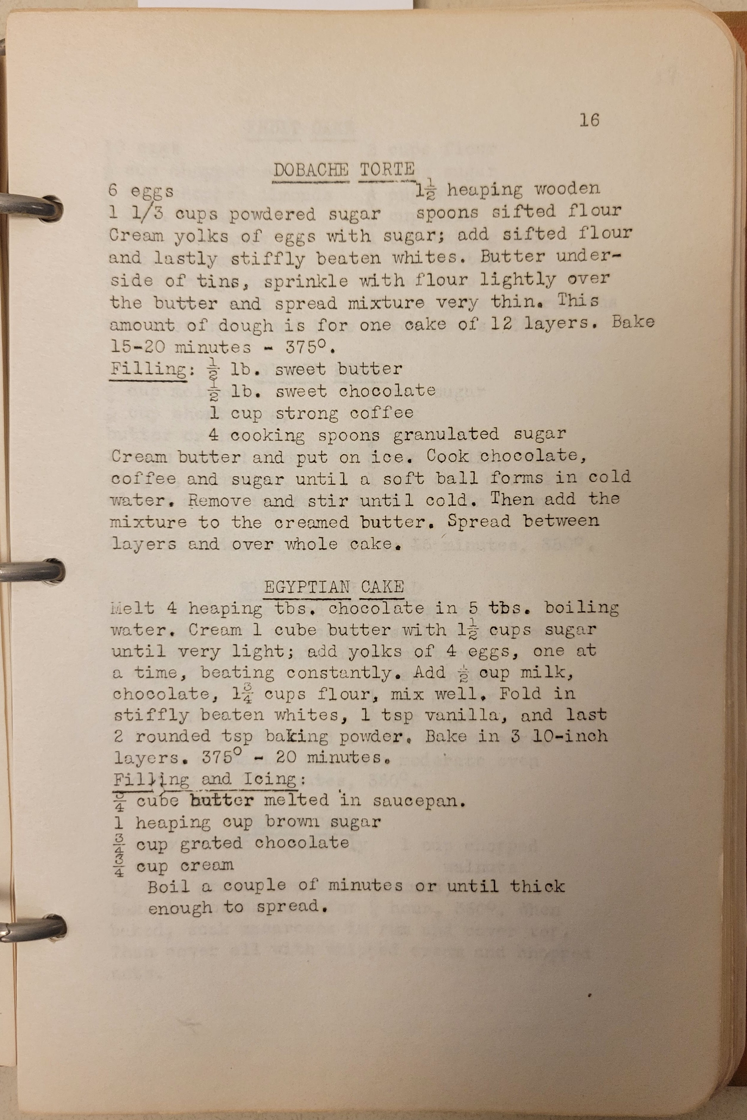 typewritten page in a 3-ring binder with recipes for Dobache Torte and Egyptian Cake