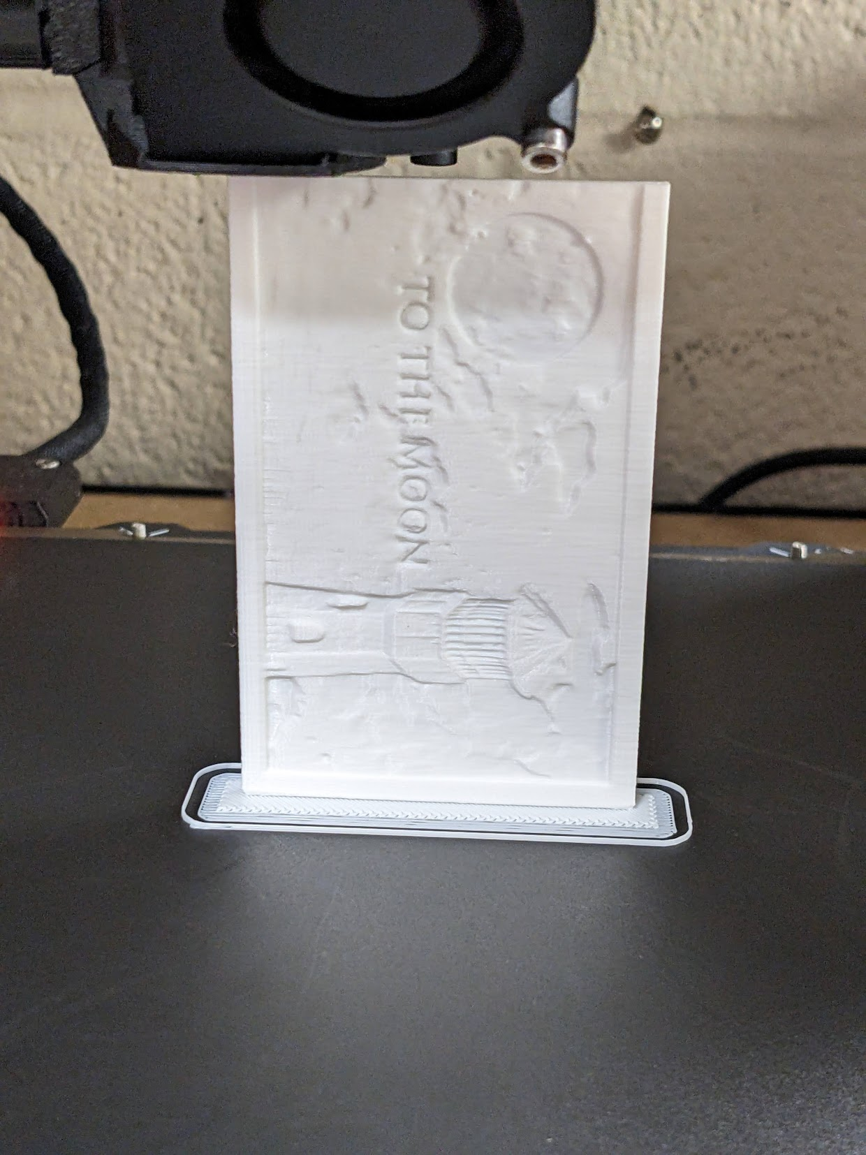 3d printer printing a white model