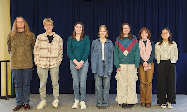 Line-up of seven students.