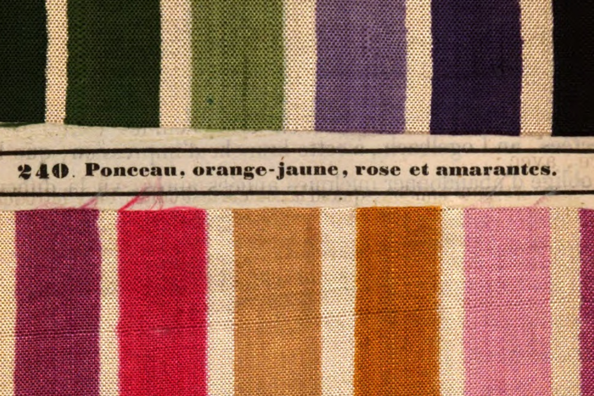 array of blocks of colored fabric with caption between in french