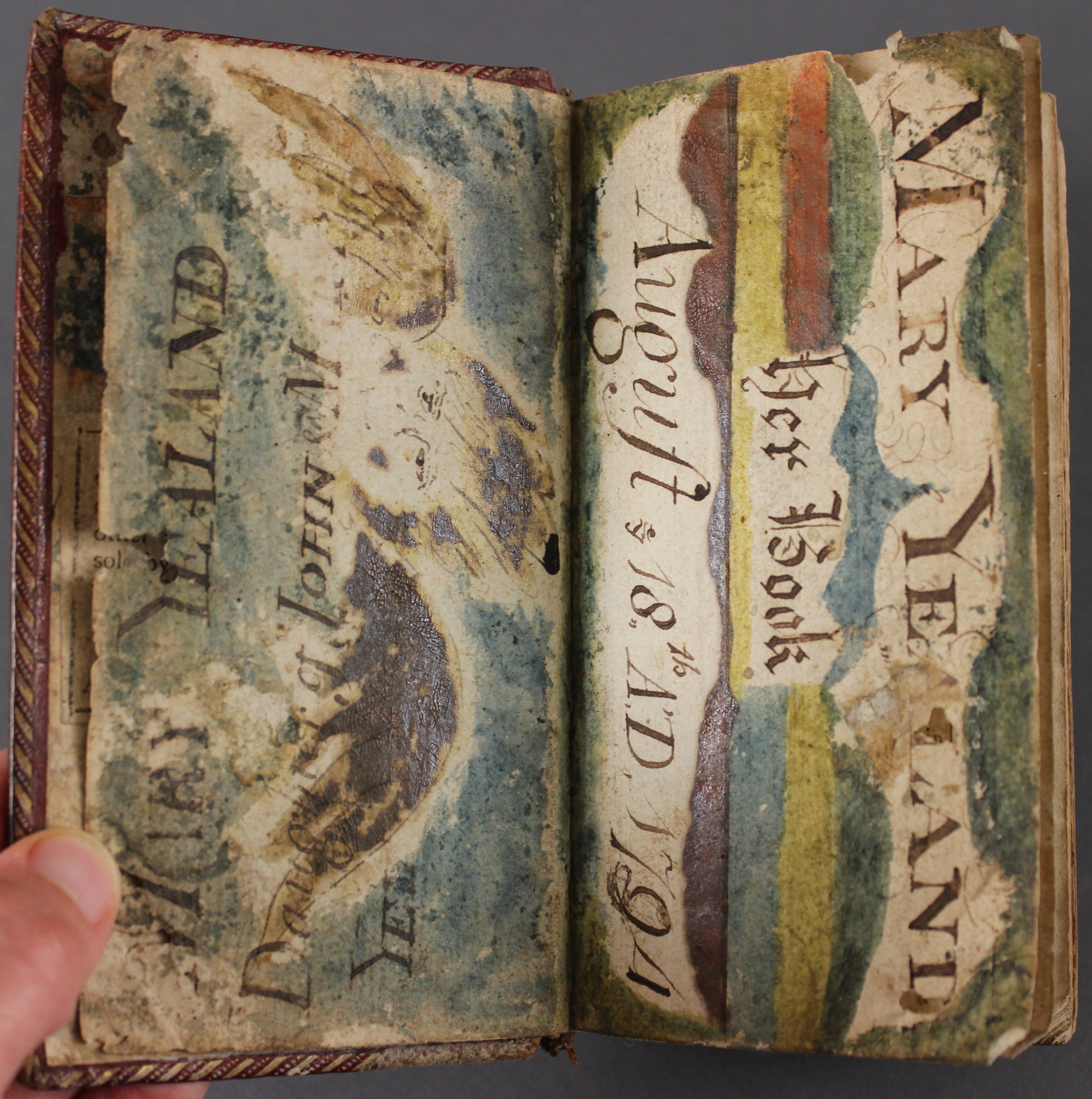 Plain endpapers elaborately decorated with owner inscriptions/paintings.
