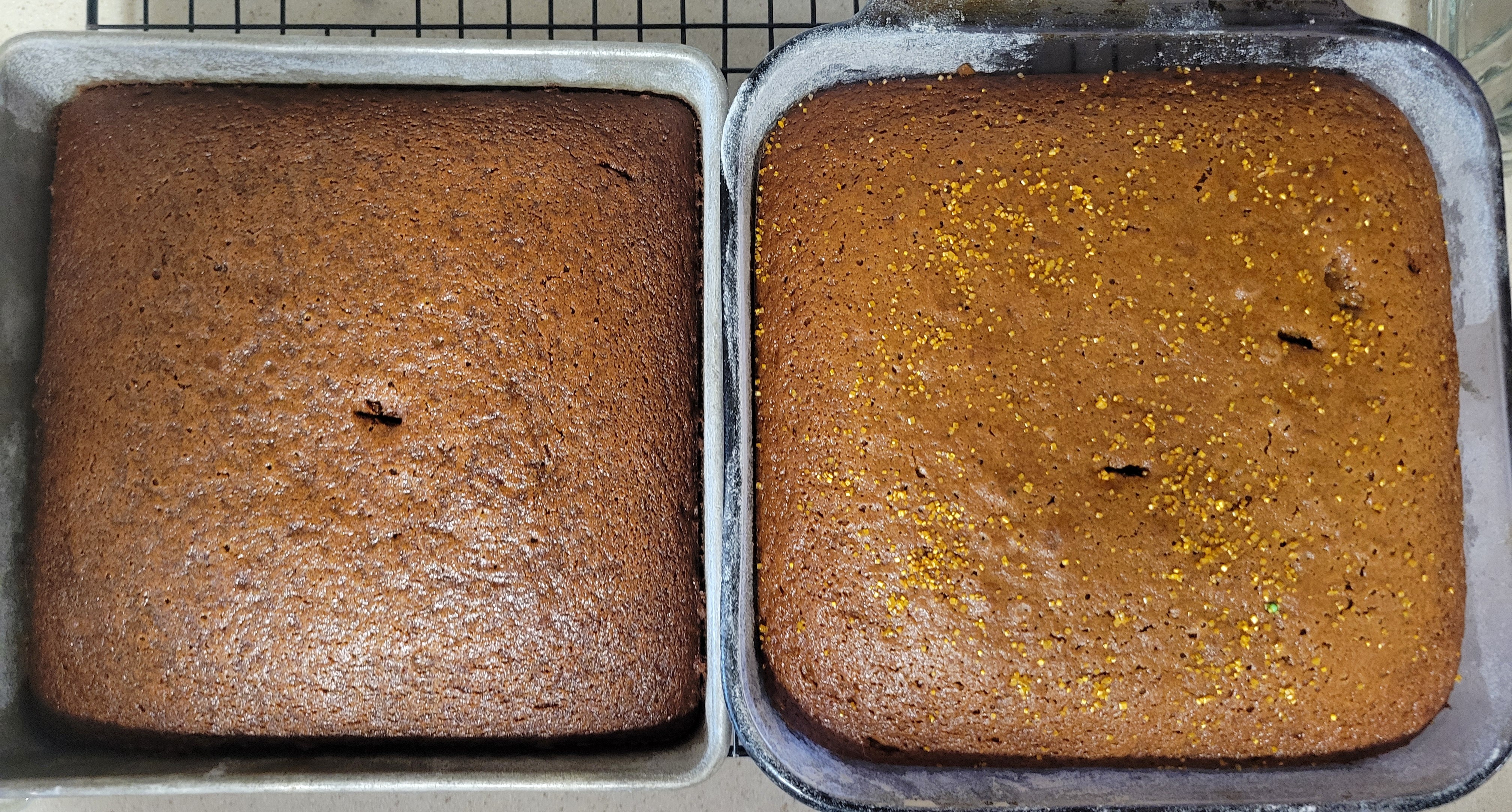 Two pans of fully baked gingerbread cake. The one on the left is slightly darker brown, but it is less noticeable once they are baked.