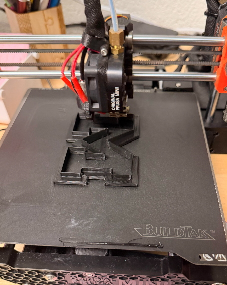 cookie cutter print being finalized on 3d printer