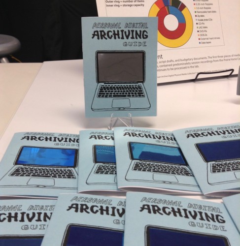 A table display of a collection of Personal Digital Archiving zines, with the image of a laptop on the cover with a mirrored screen