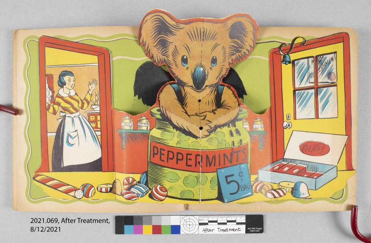 colored drawing of koala bear emerging from a jar of peppermints with shocked woman looking on