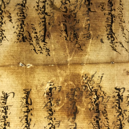 View of scissors watermark across the fold in Isl. Ms. 569 p.10/11