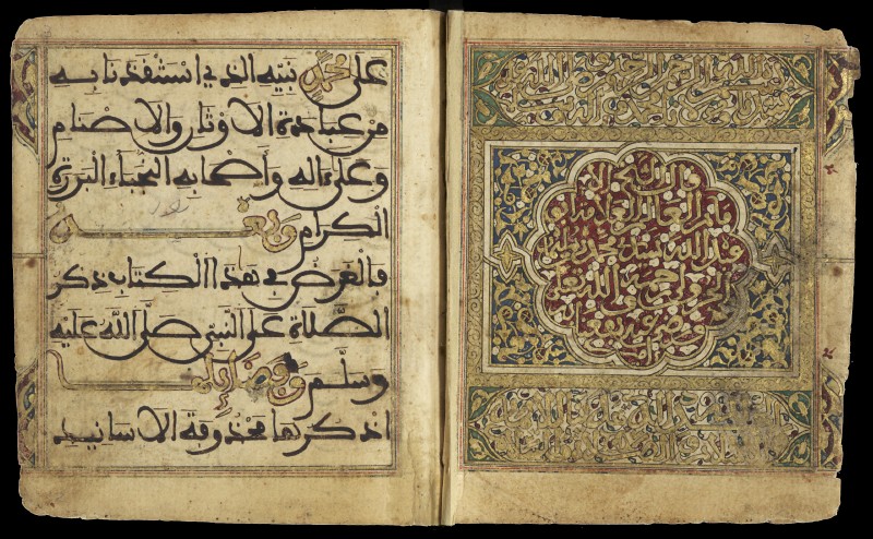 Double-page opening from a manuscript with Arabic writing in black, gold and colors, framed by vegetal designs