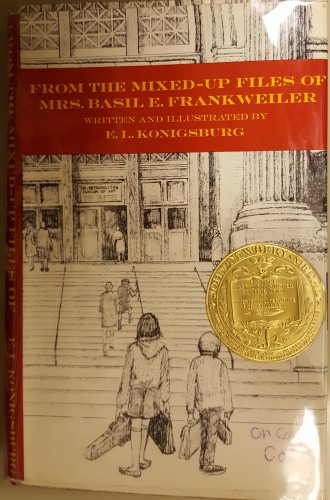 Cover of book showing a boy and girl in line drawing in the city