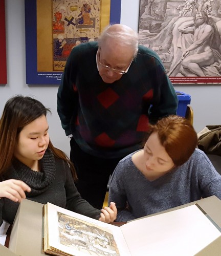 students looking at rare books