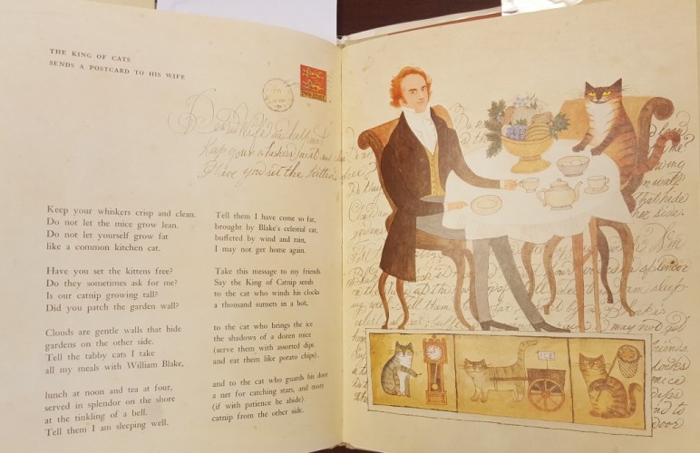 On the left is the text of "The King of Cats..." and on the right is an illustration of a man and a cat eating at at cafe table