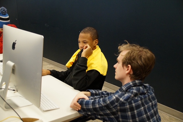 Image of student and mentor working on the computer