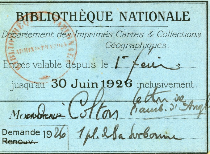 Small blue card with writing on it in French