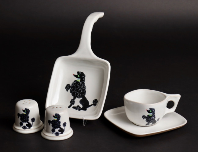 White china decorated with black poodles