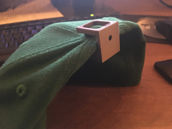Hat on 3d printed display mount before being mounted to the wall