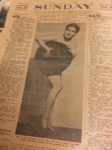 newspaper sheet with columns of text and photo of Holly Fine