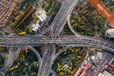 An aerial view of intersecting highways. An orange "inactive" banner is across the top corner.
