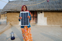 Woman holding solar panels