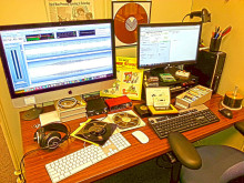 Work desk covered in different audio media formats