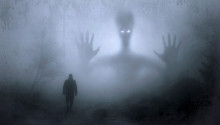 A person facing a scary creature in the foggy darkness 