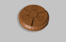 A model of a 3D printed button with faces for 3 different emotions on it. 