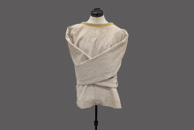 undyed canvas straitjacket on a half body mannequin