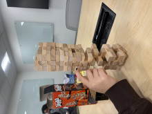 A student playing Jenga at the Board Game Night.