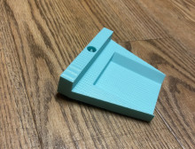 A blue 3d printed head for a putter (golf).