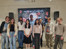 Students standing in the Shapiro Gallery for Cafe Shapiro 2026.