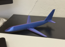 3d printed blue and purple model airplane.