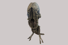 molded fantastical figure with lots of teeth 
