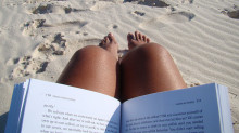 Photo of a book being read on the beach