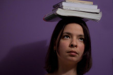 Woman with books on her head