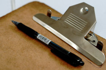 Image of a clipboard and pen