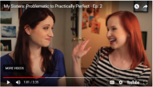 Screenshot showing Lizzie smiling at Lydia, who is offering a high-five