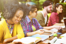 Image of students studying and reading textbooks.