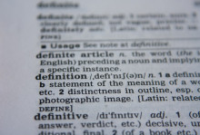 image of a dictionary page with definition of definition in view