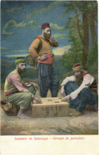 Three dockworkers from Salonica, two of them sitting and one standing