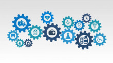 Image of gears of varying sizes, each containing a health symbol within including a heart, microscope, ambulance, clipboard, and beaker. 