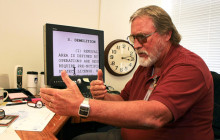 Person sitting at a desk using screen magnification software.