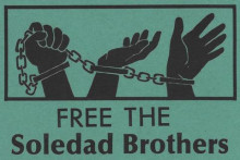 image of three cuffed and chained Black hands grasping, reaching, and gripping the chain